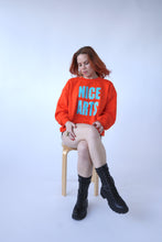 Load image into Gallery viewer, NICE ARTS unisex crewneck - Turquoise vinyl on Orange LARGE
